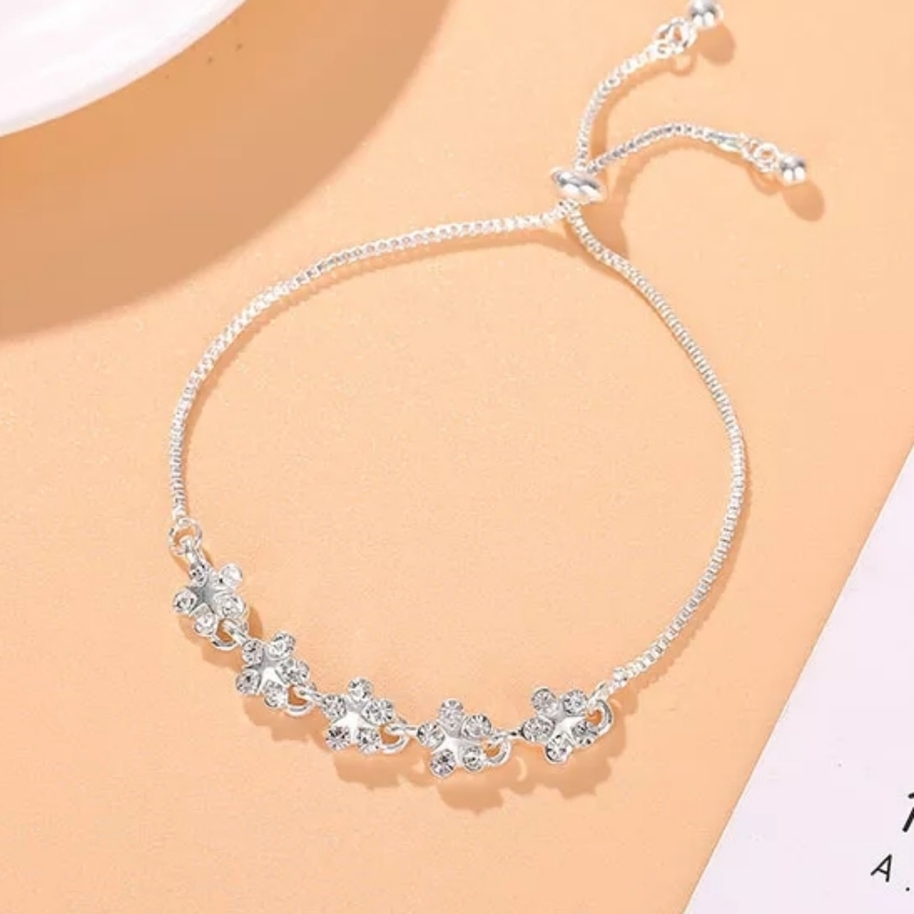 Pretty silvertone Plumeria bracelet new